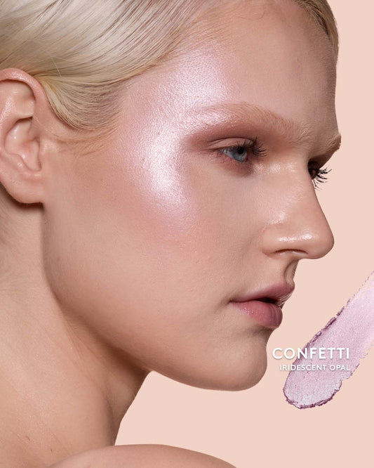 Light skin toned model wearing match stix shimmer in shade confetti.
