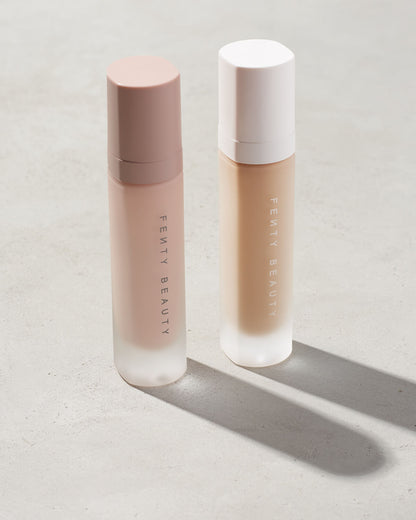 Fenty pro filter instant retouch and liquid Fenty foundation primers standing on a gray background