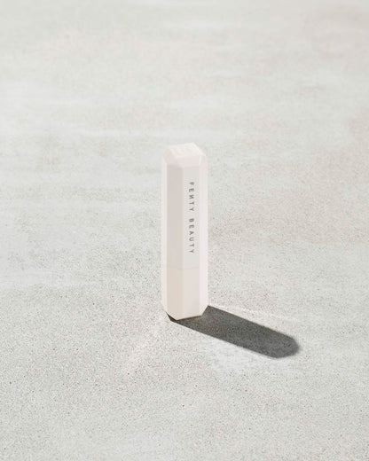 Packaging of Pro Kiss'r Lip-Loving Scrubstick, featuring a very light pink color with the prominent "Fenty Beauty by Rihanna" branding.
