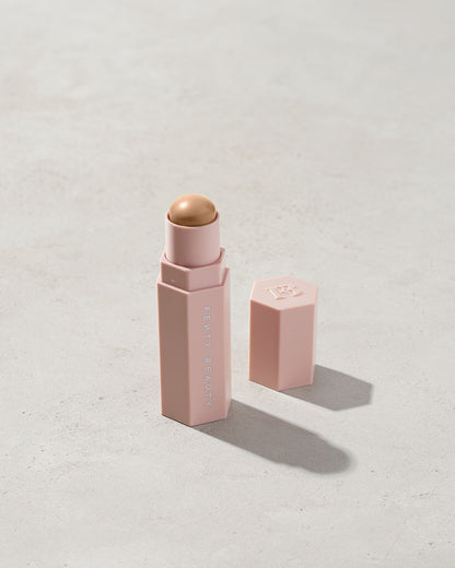 Match Stix Contour Skinstick shown in shade Soft Amber on a concrete background.