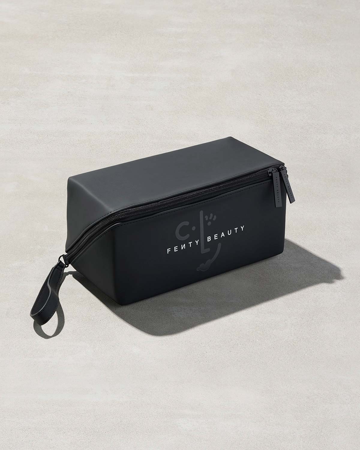 One black rectangular bag with Fenty branding on a gray background