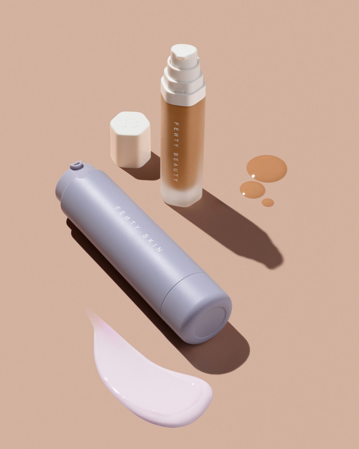 Hydra Vizor SPF Moisturizer and Soft'lit Luminous Foundation on a beige background.