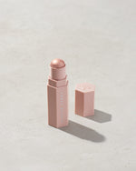Match Stix Shimmer Skinstick shown in shade Starstruck on a concrete background.