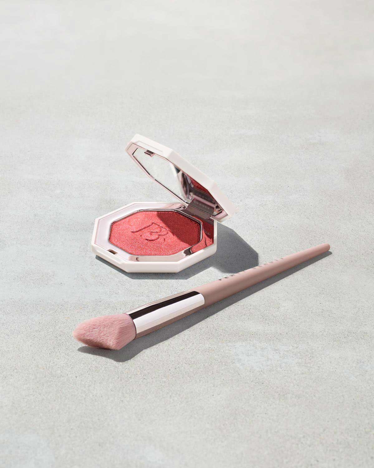 Killawatt Foil Freestyle Highlighter shown in shade Ruby Richez with Cheek Hugging Highlight Brush