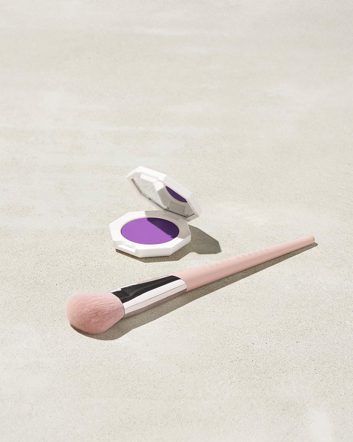 Cheeks Out Freestyle Cream Blush shown in shade Drama Cla$$ with Face Shaping Brush 125