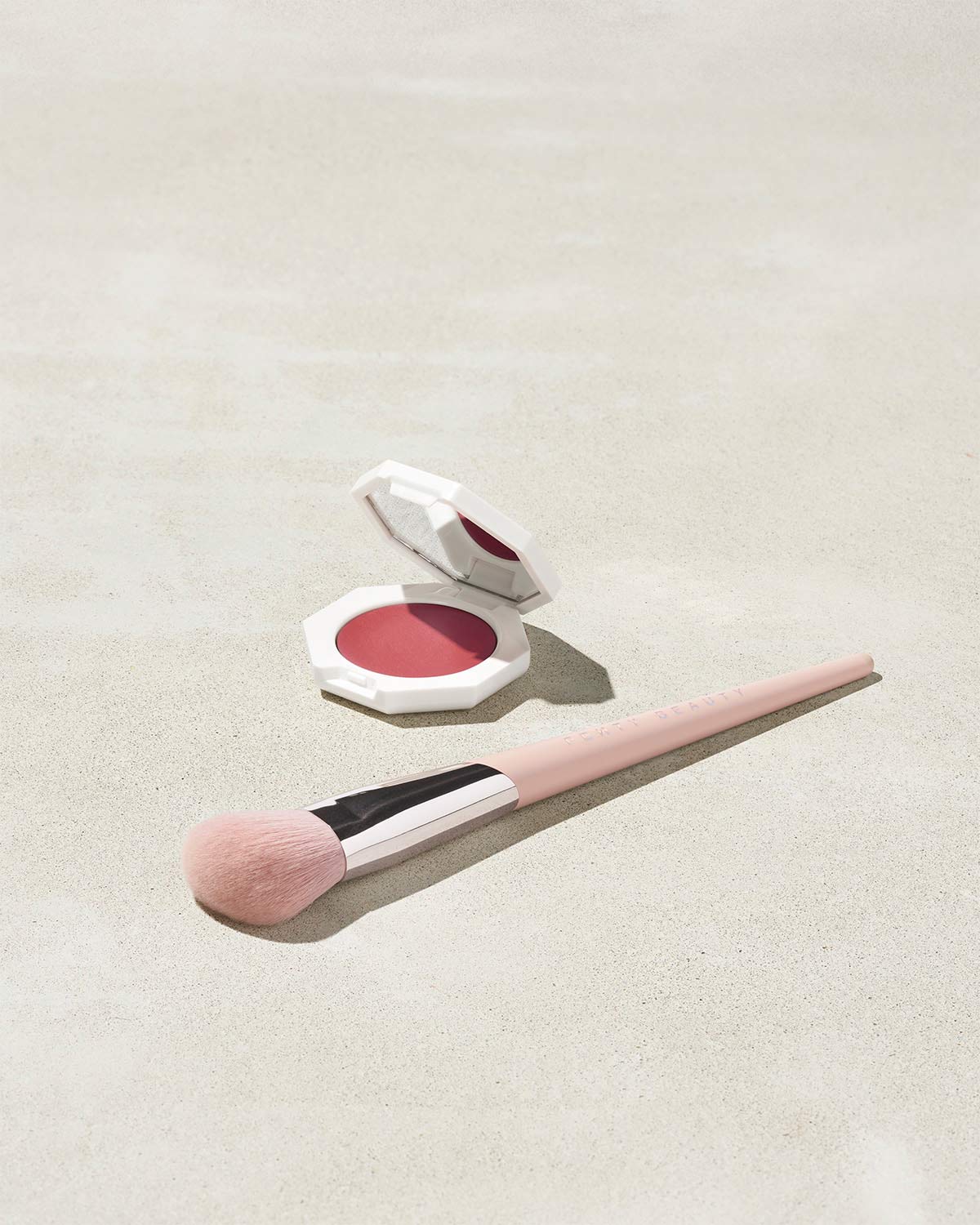 Cheeks Out Freestyle Cream Blush shown in shade Summertime Wine with Face Shaping Brush 125