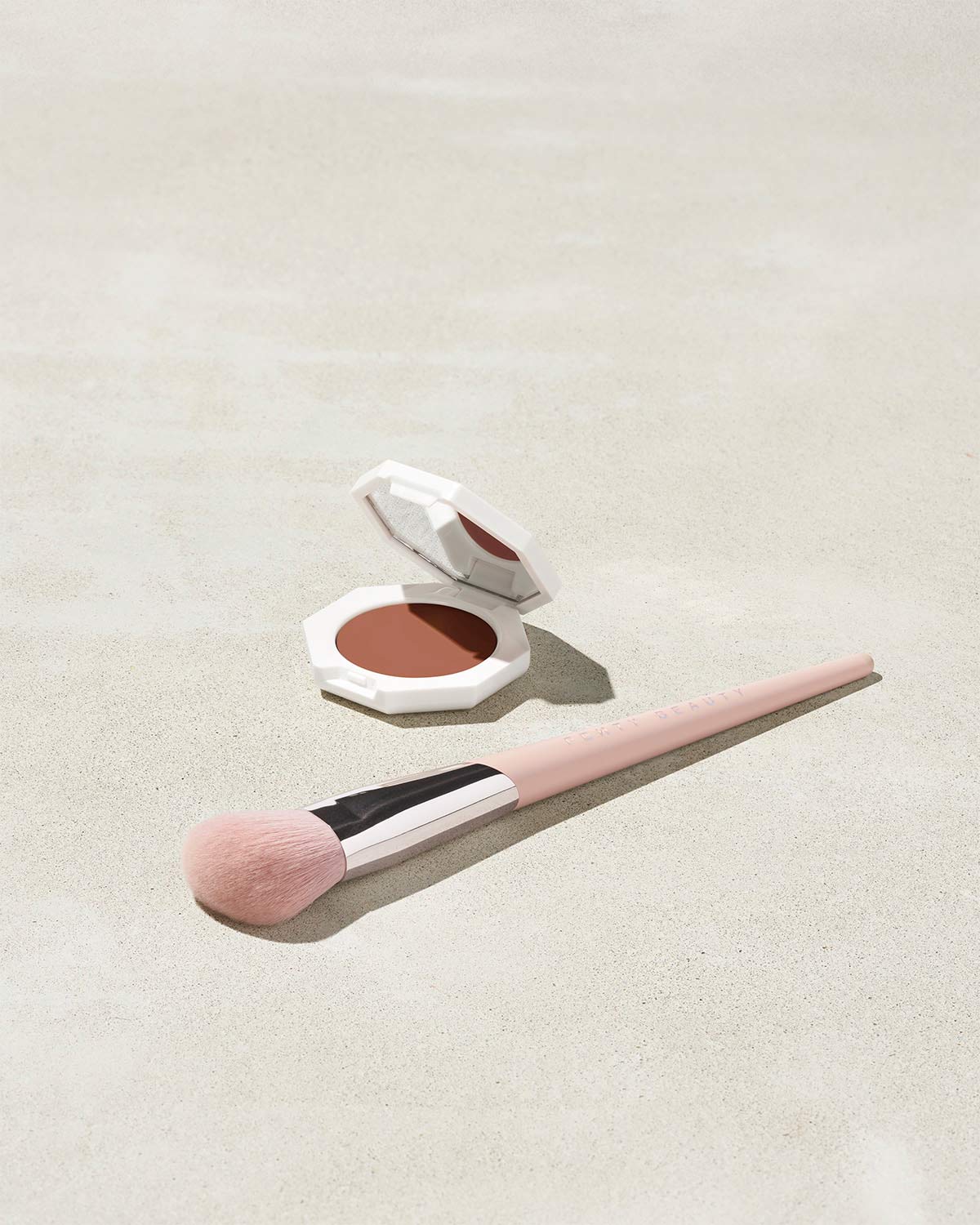 Cheeks Out Freestyle Cream Blush shown in shade Rose Latte with Face Shaping Brush 125