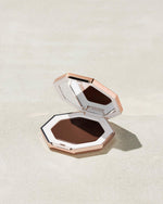 Cheeks Out Freestyle Cream Bronzer shown in shade Chocolate