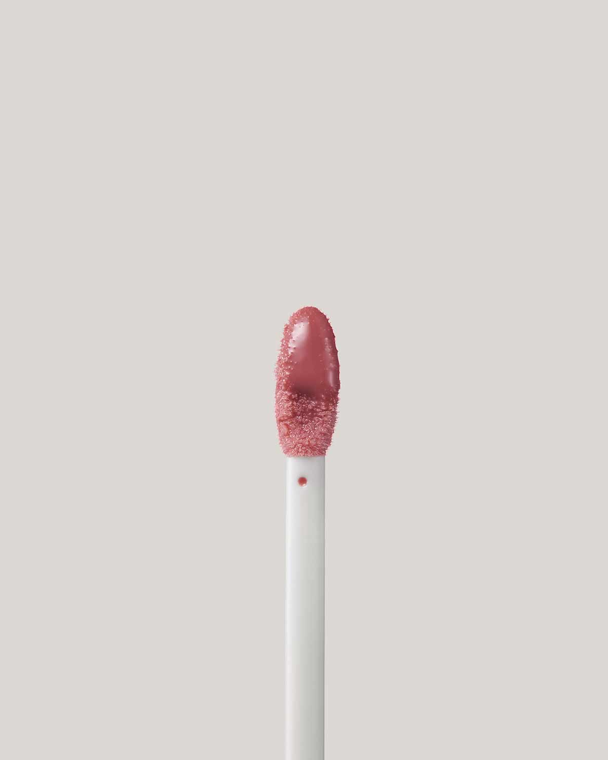 Close Up of Pro Kiss'r Luscious Lip Balm in shade Pinch Me applicator.