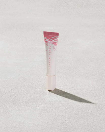 Closed Tube of Pro Kiss'r Luscious Lip Balm in shade Pinch Me on grey background.