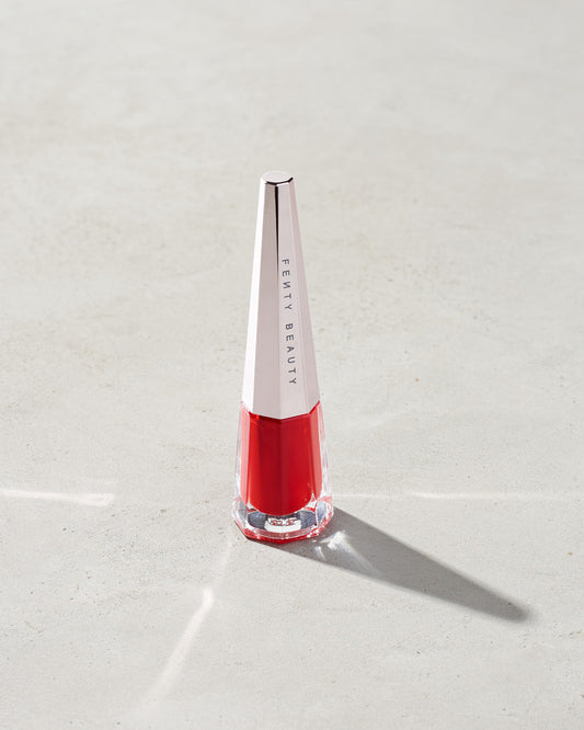 Jar of lip paint stood on a gray background