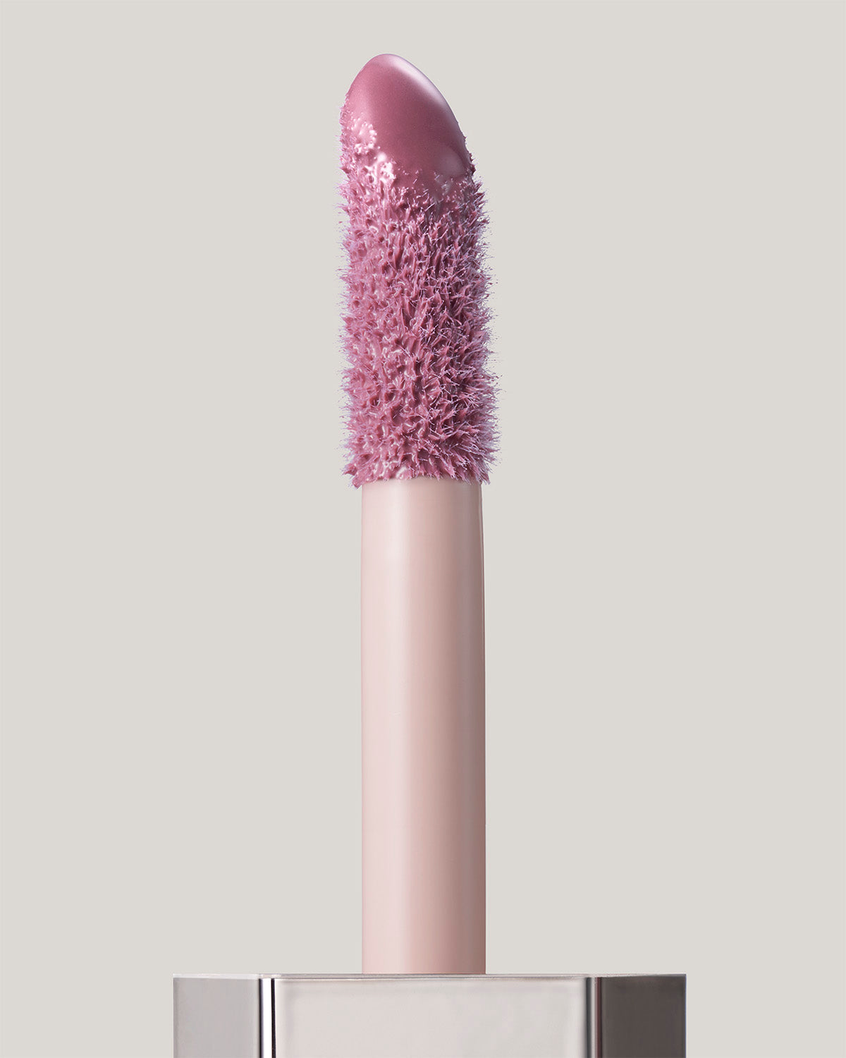 Gloss Bomb Cream applicator shown in shade Mauve Wive$