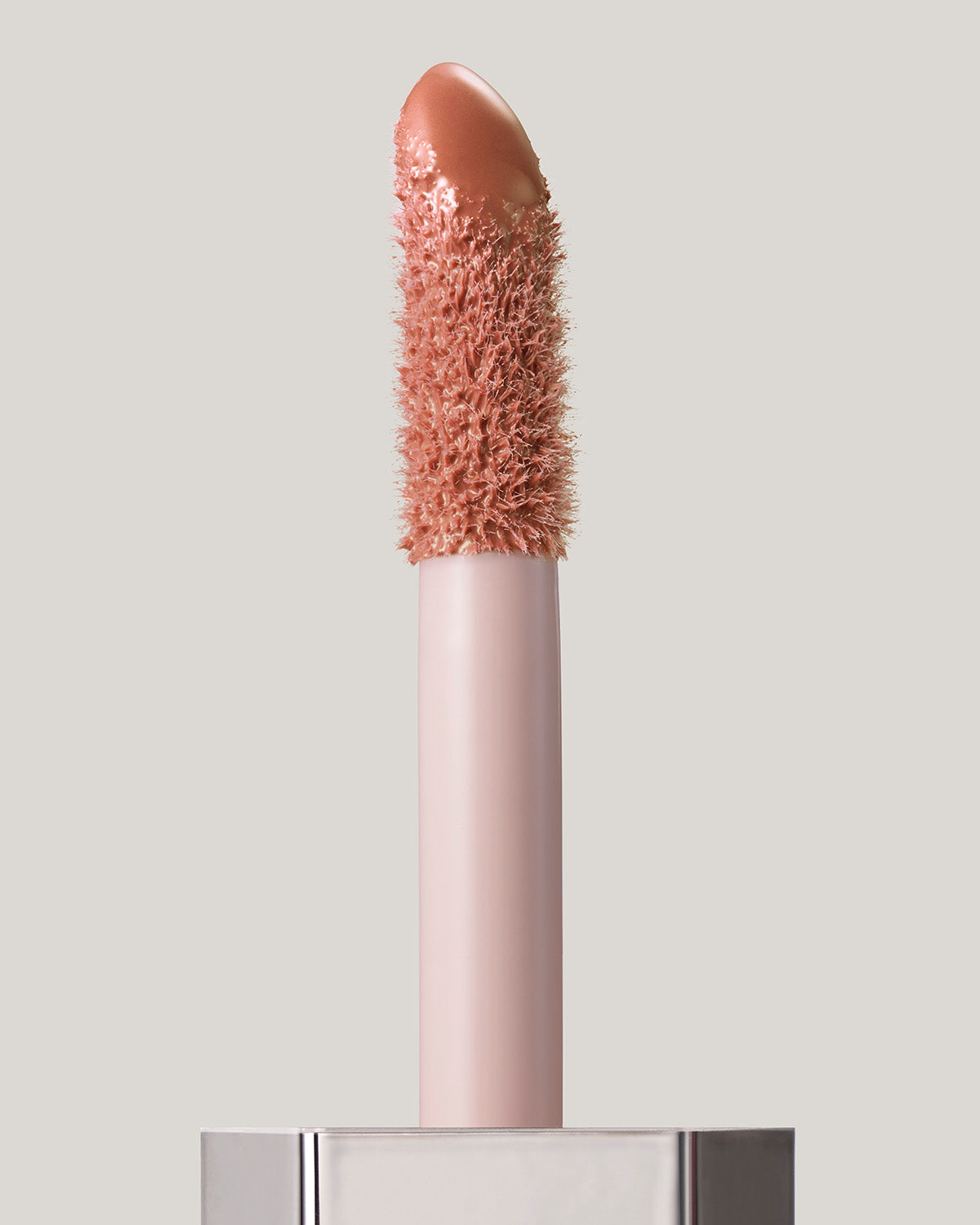 Gloss Bomb Cream applicator shown in shade Honey Waffles