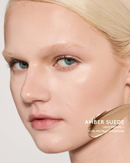 Light-medium skin toned model wearing match stix contour in shade amber suede.