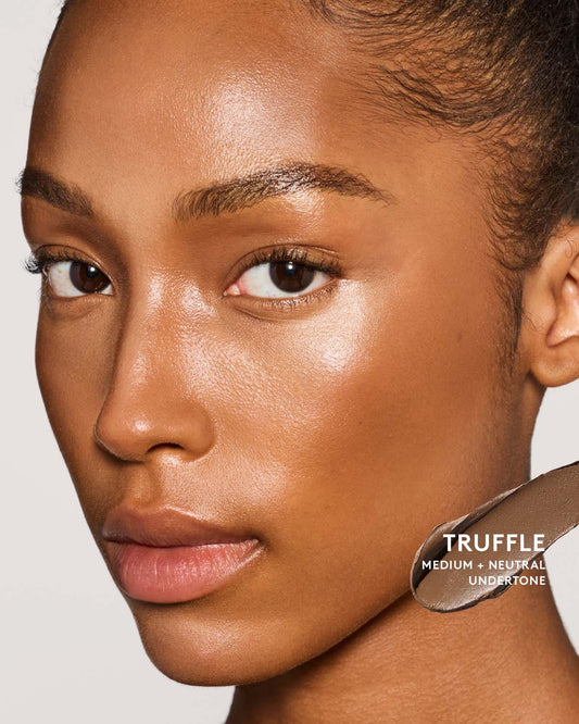 Medium Skin Tone Model wearing match stix contour in truffle.