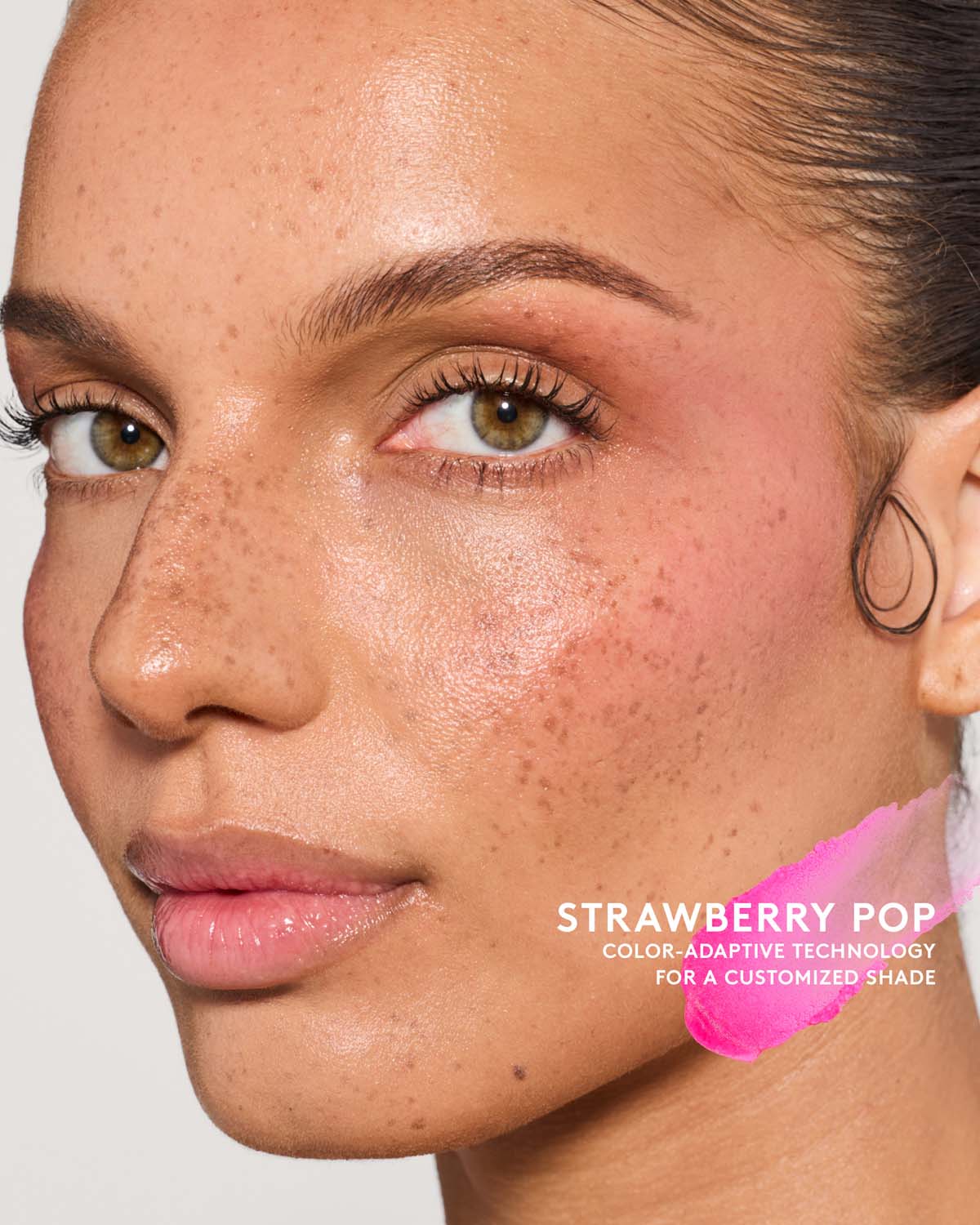 Model wearing match stix color adaptive in shade strawberry pop.