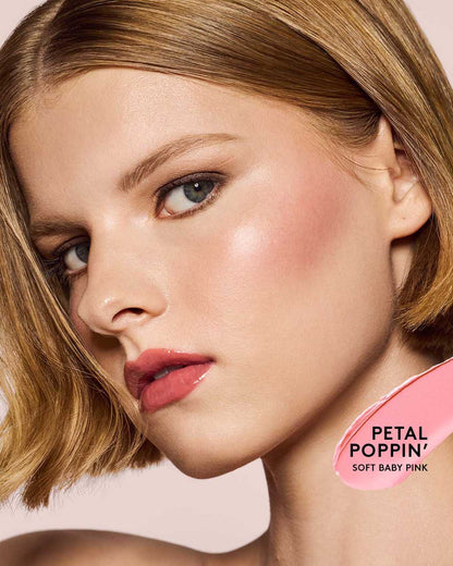 light skin toned model wearing cheeks out freestyle cream blush in shade petal poppin
