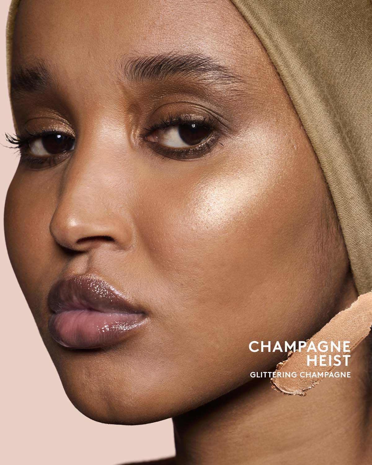 Model wearing match stix shimmer in shade champagne heist