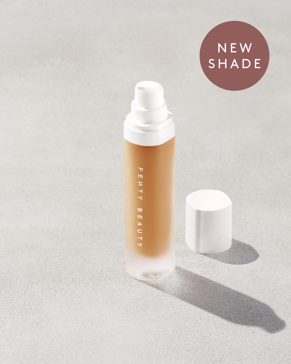 An open bottle of a new shade of Pro Filt'r Soft Matte Longwear Foundation in the shade 335 on a grey background.