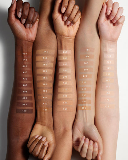 Fenty Beauty's collection of Pro Filt'r Soft Matte Longwear Foundation shades for light, light-medium, medium, medium-deep or tan, and deep skin tones shown as arm swatches on models of various skin tones