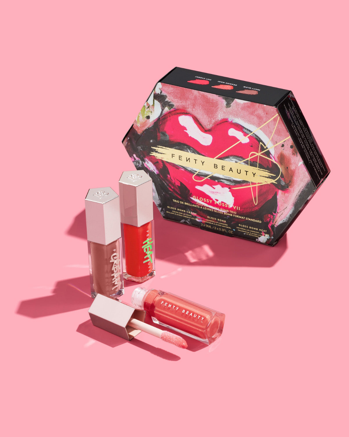 Editorial shot of Glossy Posse volume 7 on a pink background.