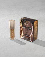 Product shot of Fenty Beauty Gloss Bomb Universal Lip Luminizer and packaging in limited edition Arcane collection shade Risky Ruling.