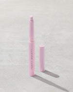 Open shot of Shadowstix Diamonds Diamond Veil Eyeshadow Stick in shade Miss Prissy on a concrete background.