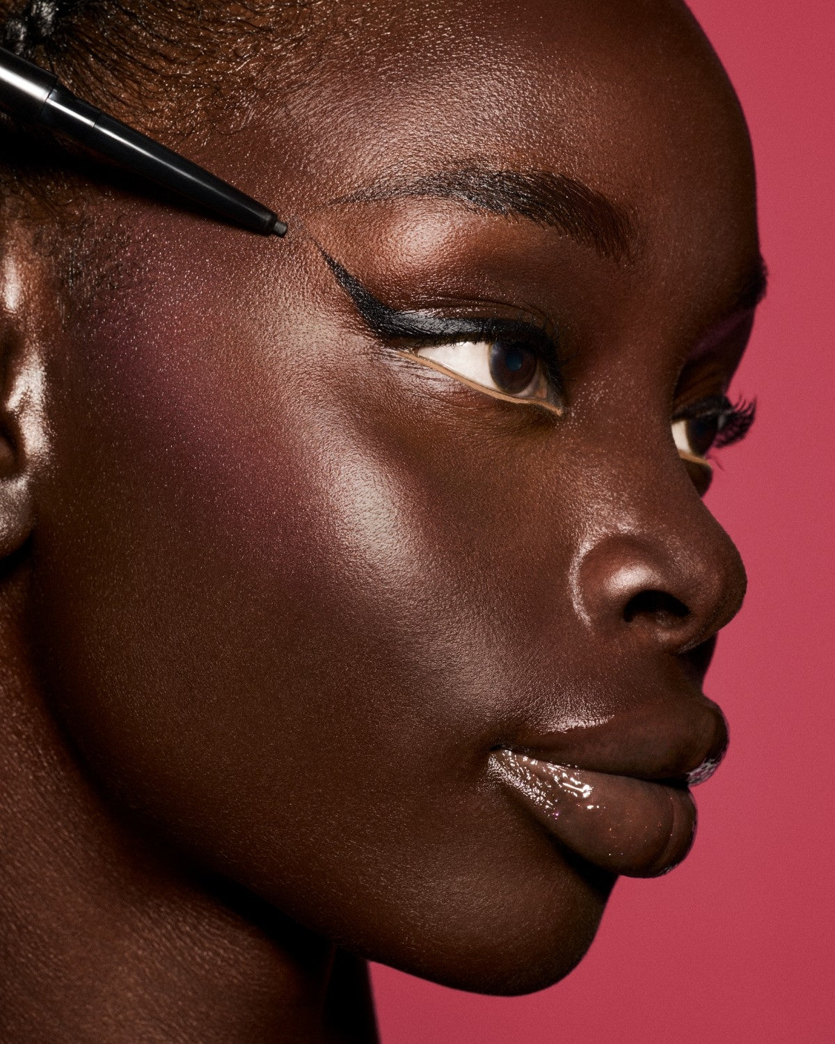 Model wearing Fine Linez Lash-Enhancing Eyeliner in shade 'Cuz I'm Black'.