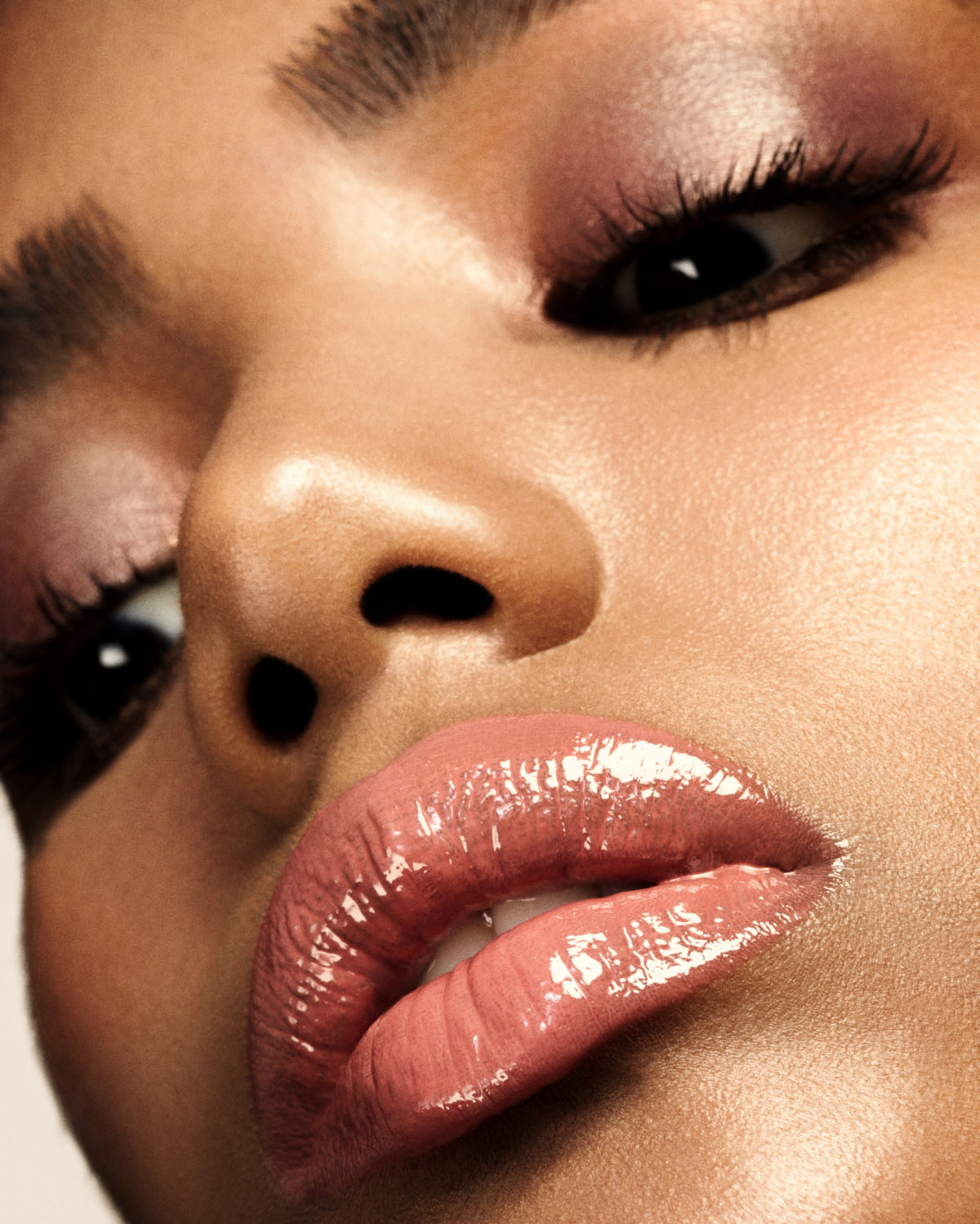 Model wearing Gloss Bomb Heat Universal Lip Luminizer + Plumper — Candy Lava