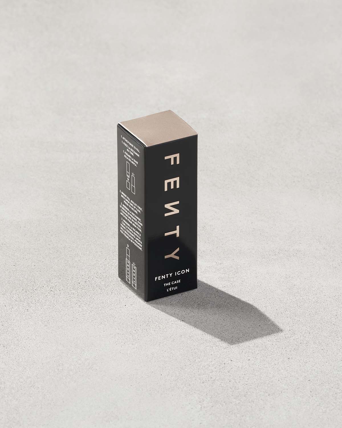 Fenty Icon refillable lipstick case in the product box.
