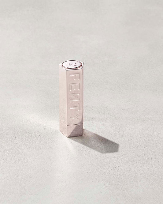 A Fenty Icon metallic refillable lipstick case.