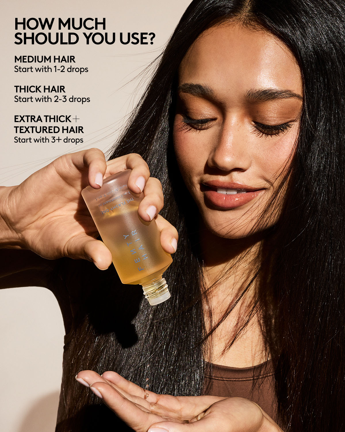 Woman holding a bottle with hair product instructions on usage