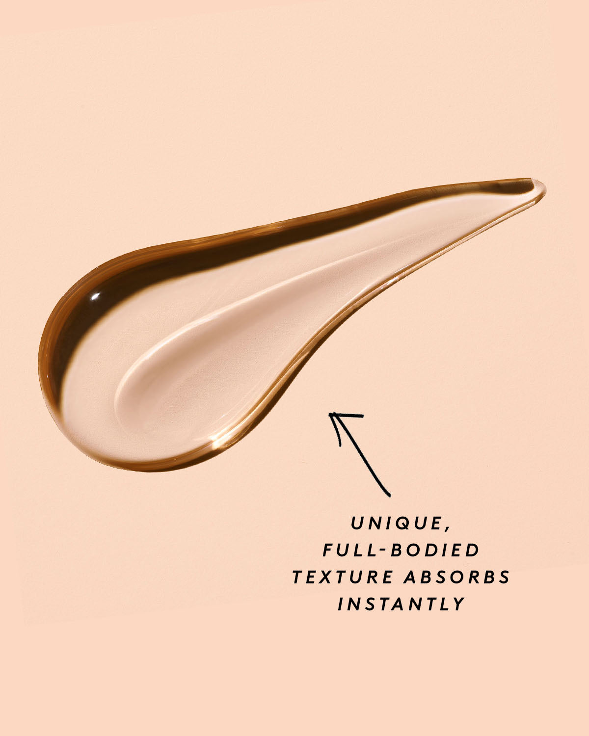 A smear of Fat Water Toner Serum against a peach pink backdrop.