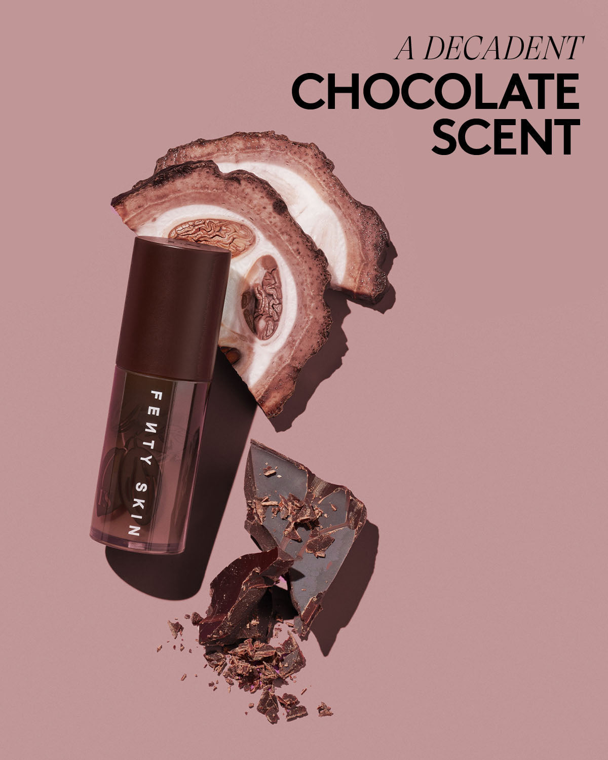 Fenty Skin Lip Oil product with chocolate elements on a pink background