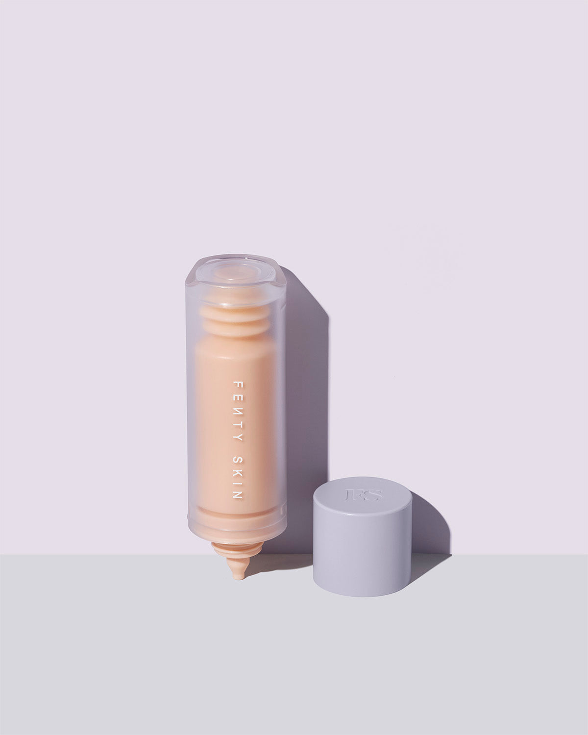 The Watch Ya Tone Niacinamide serum opened container on a lilac background.