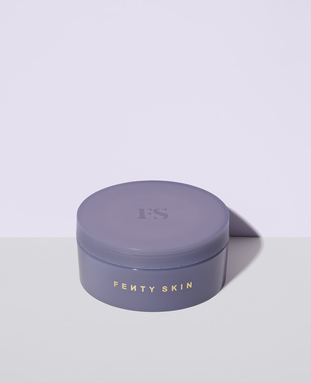 Closed tub of Butta Drop Whipped Oil Body Cream with Tropical Oils + Shea Butter.