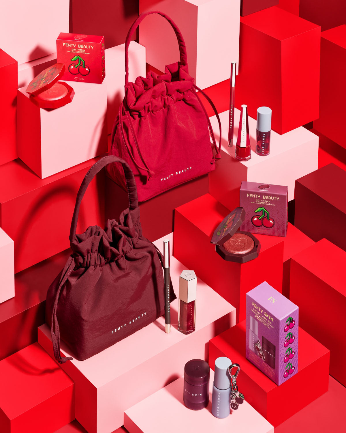 Editorial shot of the Fenty Beauty and Fenty Skin product assortment for the Sweet Cherries limited edition collection.